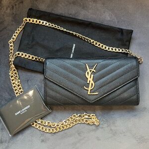 Black YSL cassandre wallet on chain gold